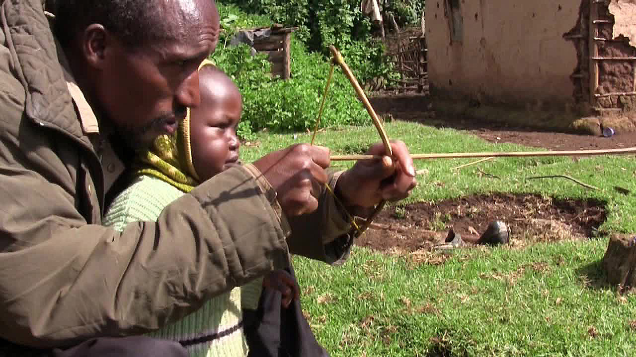 Ogiek-Still-Beutan-teaching-son-to-hunt